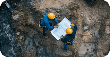 Engineers reviewing plans on a construction site